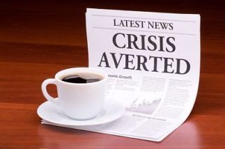The newspaper LATEST NEWSwith the headline CRISIS AVERTED